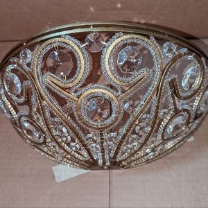 1 wall sconce by Portfolio. Glass and metal with antique gold finish.